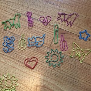 Bucket of colorful, fun shaped paper clips